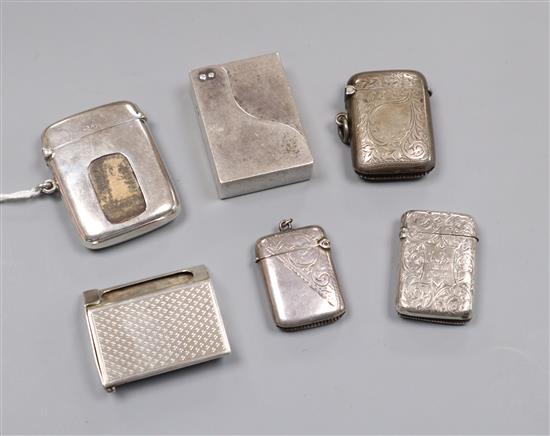 A George V silver patent Auto Matchbox,Wright & Davies, London, 1920, four other silver vesta cases and a silver match sleeve.